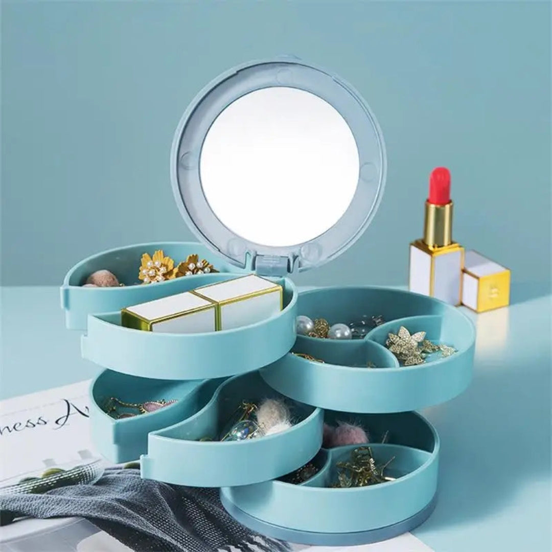 Boite a bijoux fille de couleur bleue, au design élégant et compartiments rotatifs, parfaite pour organiser les bijoux avec style.