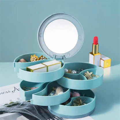 Boite a bijoux fille de couleur bleue, au design élégant et compartiments rotatifs, parfaite pour organiser les bijoux avec style.