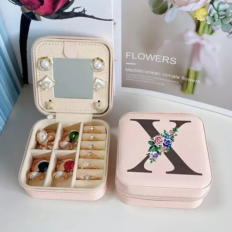 Boite à bijoux initiale X élégante avec fermeture zippée