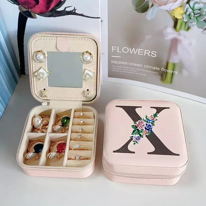 Boite à bijoux initiale X élégante avec fermeture zippée