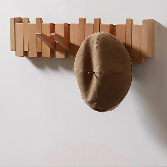 Patère bois avec crochets escamotables et système magnétique sécurisé.